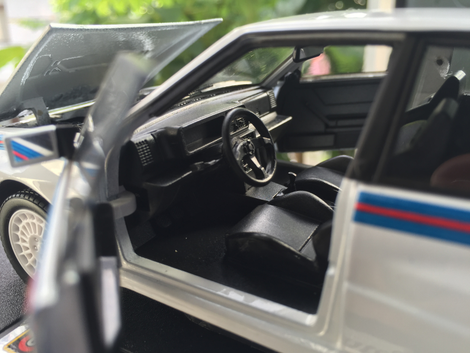 Interior is quite nice. One piece plastic moulding with no stickers to detail the centre console but sweet steering wheel!